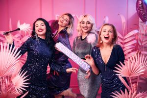 Group,Of,Four,Smiling,Pleased,Beautiful,Caucasian,Females,With,Ostrich