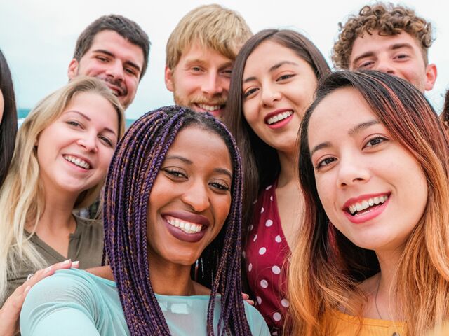 Young,Friends,From,Diverse,Cultures,And,Races,Taking,Photo,Making