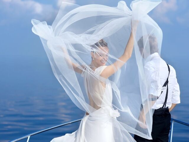 Happy,Bride,And,Groom,Hugging,On,A,Yacht