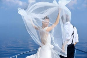 Happy,Bride,And,Groom,Hugging,On,A,Yacht