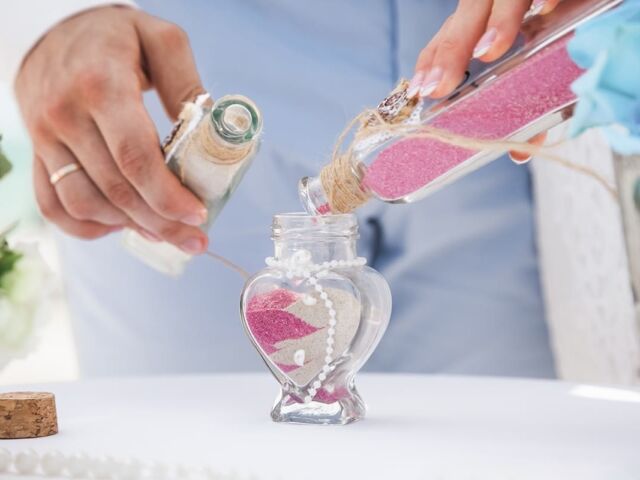 Bride,And,Groom,Pouring,Colorful,Different,Colored,Sands,Into,The