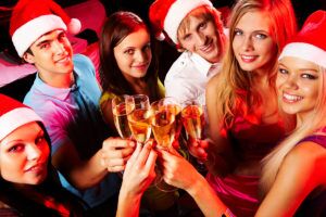 Above,Angle,Of,Young,People,Enjoying,Themselves,At,Christmas,Party