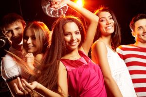 Group,Of,Teens,Dancing,In,Night,Club,With,Glamorous,Girl
