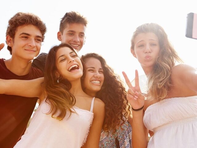 Group,Of,Teenage,Friends,Dancing,And,Taking,Selfie