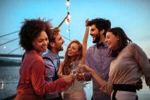 Cropped,Shot,Of,A,Group,Of,Friends,Celebrating,With,Champagne